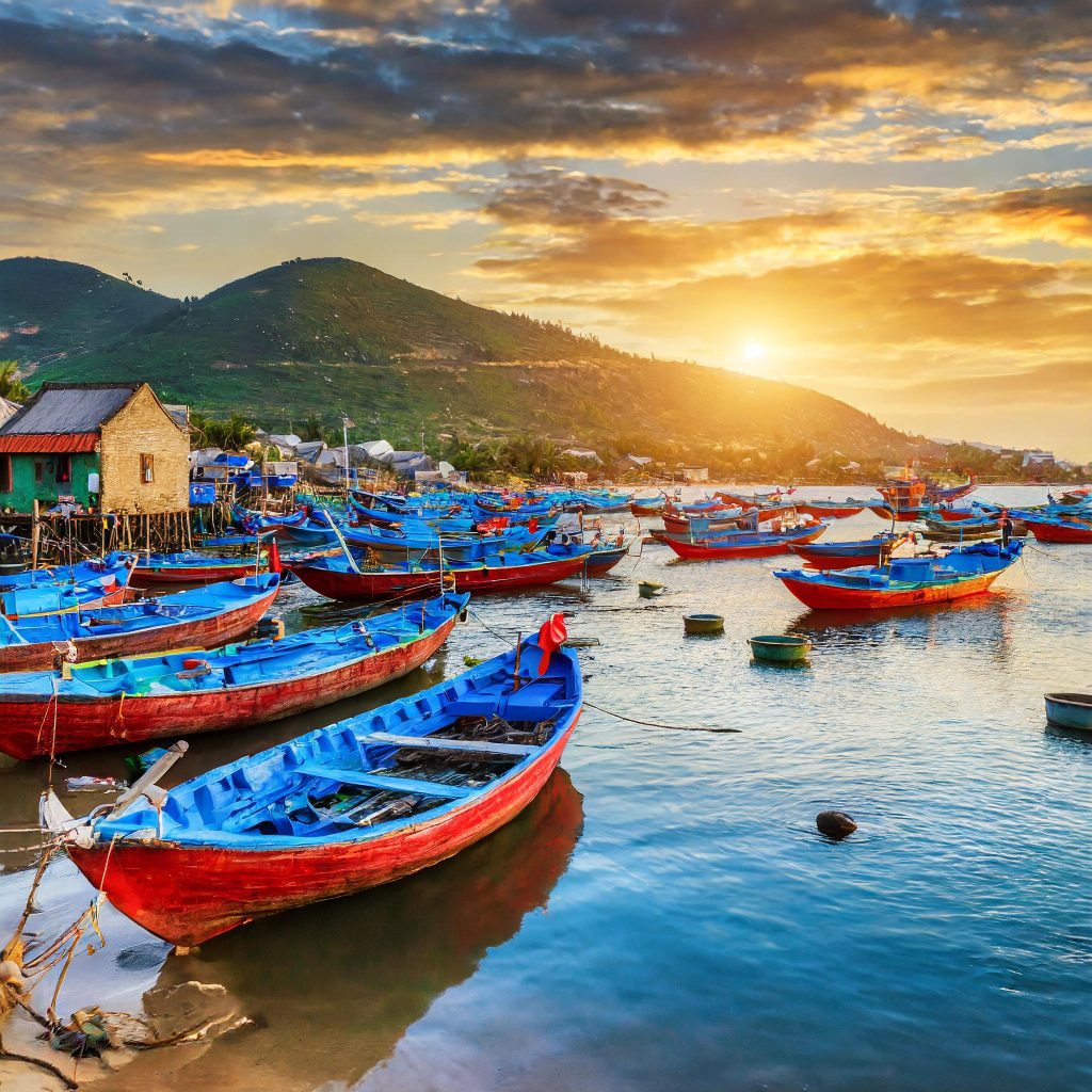 Vietnam fishing boats in port at sunset