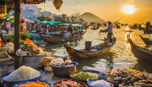 Vietnam market on river at sunset