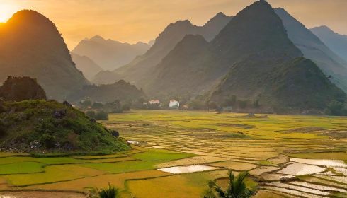 VN23 Vietnam mountains and rice paddies landscape at sunset